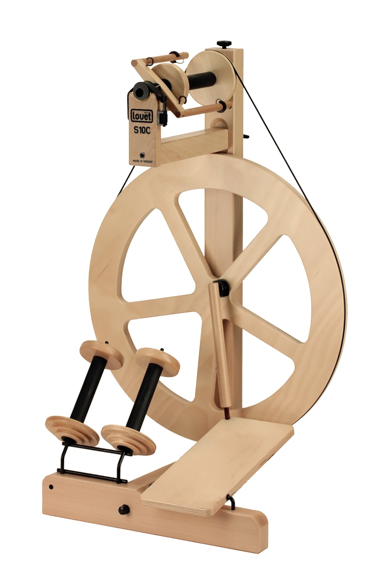 A wooden spinning wheel with a large circular wheel, two foot pedals at the base, and a tension rod. The mechanism for spinning yarn is at the top, and there is a small plaque reading "Louët S10C". This Irish Tension Single treadle model has a natural wood finish and minimalist design.