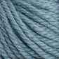 Close-up of Halcyon Yarn Classic Rug Wool in light blue from Caledonian Dye Works, showcasing its soft texture and twisted strands. This thick yarn, reminiscent of premium Rug Wool, is perfect for knitting or crocheting projects. The fibers are slightly fuzzy and hand-dyed, giving it a cozy, warm appearance ideal for weavers.