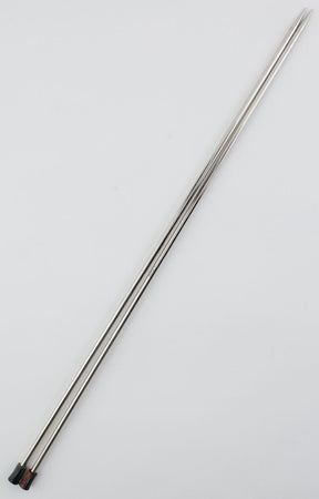 A pair of Nova Platina Single Point Knitting Needles by Accessories Unlimited, featuring pointed ends and black tips on one side, resembling metal skewers, placed diagonally on a plain white background.