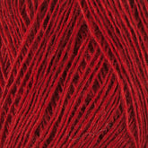 Close-up view of Einband Lopi yarn by Berroco, Inc. The threads are loosely wound together, showcasing the texture and fibers in the Icelandic wool. The vibrant red color is uniformly distributed across the strands, perfect for intricate lace knitting projects.