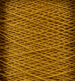 Close-up view of a mini-cone of golden yellow 10/2 Pearl Cotton Yarn by Supreme Corp., showcasing densely woven strands crisscrossing in a neat, uniform pattern. The texture of the yarn is clearly visible, highlighting its fine, smooth nature and exceptional colorfastness.
