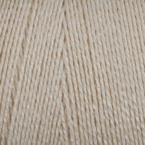 Close-up of Maurice Brassard's 8/2 Bamboo Yarn mini-cone fibers arranged in parallel lines, showcasing their cream-colored texture and thickness. The yarn appears soft and slightly glossy, indicating a smooth, high-quality material suitable for knitters or crocheters seeking environmentally friendly options.