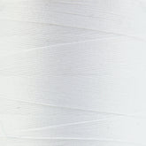 Close-up image of a spool of YLI Corp.'s Woolly Nylon Reinforcement Yarn, tightly wound with visible parallel lines creating a textured, striped pattern. The surface has minimal imperfections, resembling the finish on high-quality socks, and the overall appearance is clean and uniform.