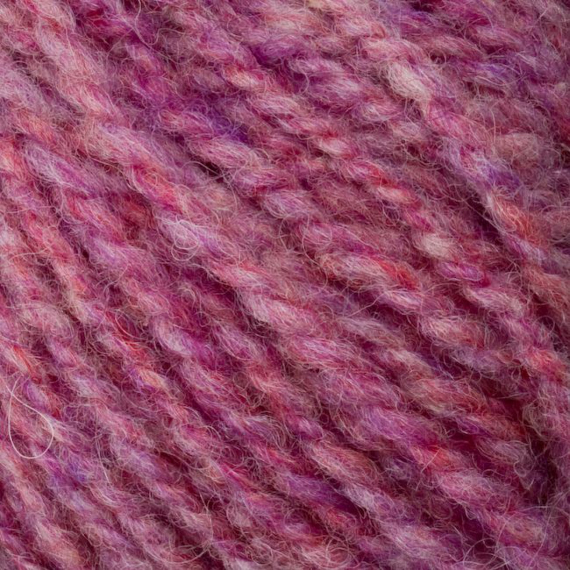 Close-up of a skein of Bartletts Maine Wool - Sport yarn from Bartlettyarns featuring a blend of pink, purple, and red hues. The yarn is thick and textured, showcasing a mix of light and dark shades that create a marbled effect. The fibers appear soft and fluffy.