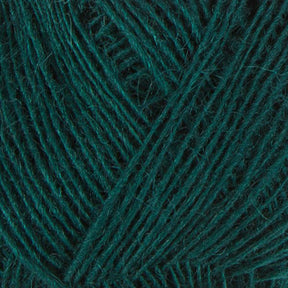 Close-up image of Einband Lopi dark green yarn. The fibers are neatly wound in a crisscross pattern, giving a textured appearance. The soft and slightly fuzzy yarn from Berroco, Inc. is ideal for knitting or crocheting projects, perfect for intricate lace knitting or beautiful stranded colorwork designs.