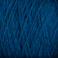 Close-up image of Harrisville Designs' blue Shetland Yarn - Unwashed Cones with a tightly woven texture. The yarn is arranged diagonally, showcasing its fibrous and slightly fuzzy surface, reminiscent of traditional Fair Isle knitting designs, giving a sense of the material's softness and thickness.