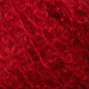 Close-up image of vibrant, red curly yarn tightly woven together. The texture appears soft and fluffy, with individual curls and strands clearly visible, showcasing the intricate details of Victorian Bouclé Mohair Yarn from Caledonian Dye Works.