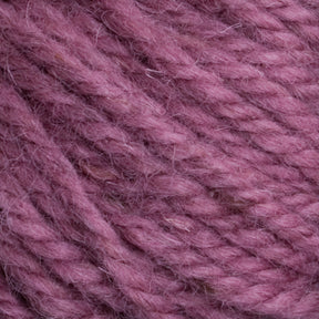 Close-up image of Halcyon Yarn Classic Rug Wool | Strand by Caledonian Dye Works, showcasing its textured, mauve-colored fibers and strands. The yarn has a soft and fuzzy appearance with detailed interwoven threads, making it ideal for knitting or crocheting projects.