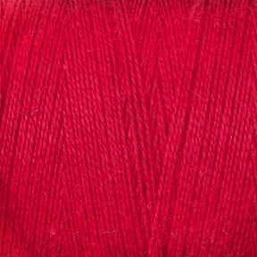 Close-up image showcasing the intricate texture and interwoven strands of Maurice Brassard's vibrant, organic 8/2 Cottolin Yarn in bright red. The yarn appears soft and vibrant, perfect for knitting or using in a four-shaft loom project.