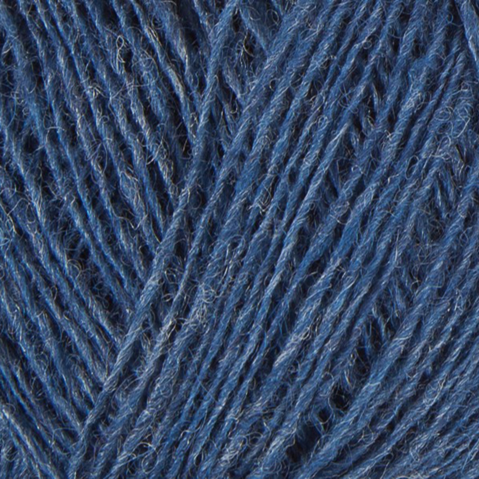 Close-up image of blue Einband Lopi Icelandic wool yarn strands tightly wound together, showing detailed texture and fibers interwoven in a repetitive pattern by Berroco, Inc.