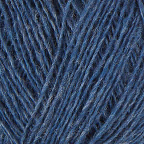 Close-up image of blue Einband Lopi Icelandic wool yarn strands tightly wound together, showing detailed texture and fibers interwoven in a repetitive pattern by Berroco, Inc.