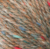 Close-up of a bundle of Peace Fleece Yarn by Harrisville Designs, showcasing strands of brown, orange, green, blue, and red fibers twisted together. The texture appears soft and slightly fuzzy with the colorful threads interwoven throughout, making it ideal for worsted weight knitting projects.