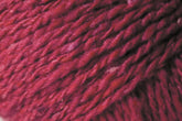 Close-up image of a ball of Jo Sharp Silkroad DK Tweed yarn by Kingfisher Yarn & Fibre. The fibers are tightly twisted, highlighting the texture of the yarn. The shade is a rich, deep red with occasional lighter and darker strands dispersed throughout.