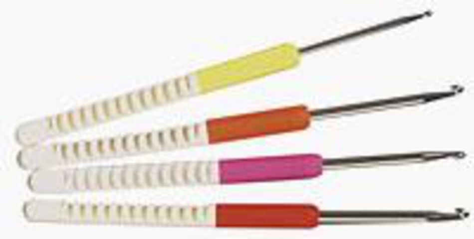 Four Skacel Soft-Handle Comfort Grip Crochet Hooks by Skacel are displayed in a parallel arrangement. The molded ergonomic handles, color-coded in yellow, orange, pink, and red with white accents, feature a ribbed dual-color design. Each crochet hook has a metal tip. The background is plain white.