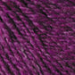 Close-up view of a textured DK weight yarn in shades of purple and pink. The fibers are thick and twisted together, giving the yarn a rich, vibrant appearance reminiscent of Jo Sharp Silkroad DK Tweed by Kingfisher Yarn & Fibre.