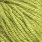 Close-up image of Halcyon Deco Rug Wool in lime green. The yarn strands by Caledonian Dye Works are loosely twisted together, showcasing the fibers' texture and slight fuzziness. This 100% wool yarn boasts a vibrant green color consistent throughout, with a soft and woolly appearance perfect for creating a versatile range of projects.