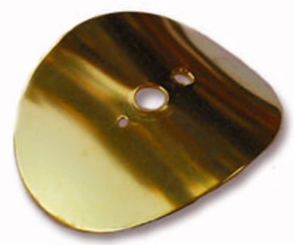 A close-up image of the Majacraft Brass Diz by Majacraft Co., showcasing its shiny, gold-colored surface with three openings reminiscent of those used by experienced spinners. The reflective surface captures variations in light and shadow, while the irregular edges and asymmetrical shape add to its unique design.