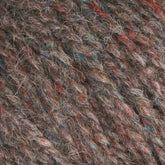 Close-up view of the Bartlettyarns Maine Wool Yarn texture, featuring interwoven fibers in shades of brown, red, and blue, creating a natural and rustic appearance typical of Bartlettyarns with its heathered colors.