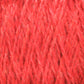 Close-up image of the vibrant Harrisville Shetland Yarn - Unwashed Cones by Harrisville Designs. The texture reveals tightly interwoven, multi-directional fibers that create a thick and soft appearance, ideal for lightweight blankets. Subtle variations in the shade of red are visible due to lighting and the physical properties of the yarn.