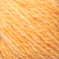 A close-up of a soft, fluffy Peace Fleece Yarn by Harrisville Designs, showcasing an orange and yellow blend with a slightly fuzzy texture. The intertwining threads create a marbled effect, highlighting the gradient blend of warm tones in this worsted weight knitting wool and mohair mix.