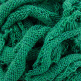 Close-up image of the Harrisville Potholder Loops - Traditional Size Mini Pack by Friendly Loom in a green knitted textile, showcasing its intricate, intertwined fibers and textured pattern. The material appears soft and layered, with varying shades of green due to the lighting.