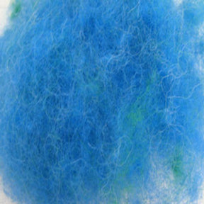 Close-up image of a blue fuzzy texture, resembling a bundle of Harrisville Designs' Dyed & Carded Wool Fiber. Some green fibers are also interspersed within the heathered colors, adding a touch of contrast. The background is plain and light-colored.