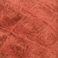 Close-up of a textured ball of reddish-brown Victorian Brushed Mohair Yarn from Caledonian Dye Works. The fibers are loosely spun, creating a soft and fuzzy appearance with visible individual strands entangled throughout the luxurious large skein.