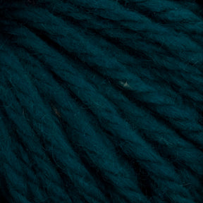 Close-up image of deep teal-colored yarn. The strands are thick and slightly textured, woven together to form a dense, fibrous surface. This hand-dyed Halcyon Yarn Classic Rug Wool | Strand by Caledonian Dye Works is rich and vibrant, highlighting the intricate details of the yarn fibers—perfect for rug weavers seeking quality material.