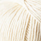 Close-up of a ball of Jo Sharp Soho Summer DK Cotton from Kingfisher Yarn & Fibre showing tightly wound strands. The texture of this lightweight cotton yarn appears soft and smooth. The image captures the fine details of the fibers and the uniformity of the meticulously arranged threads, perfect for summer projects.