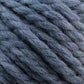 Close-up of ultra-soft, thick, twisted yarn in various shades of gray and blue, showcasing the texture and fibers of the material. This chunky Baby Alpaca Grande by Plymouth from Plymouth Yarn Co. appears perfect for knitting or crocheting projects requiring a touch of luxury.