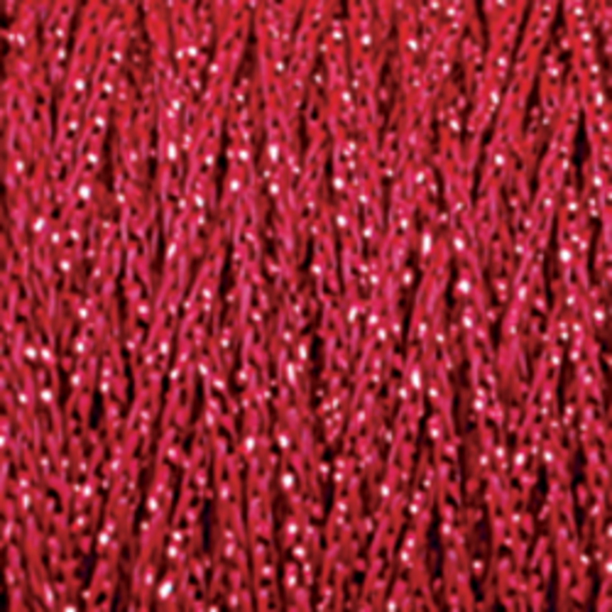 Close-up image of a textured red surface with a glossy, shimmering appearance. The texture is made up of tightly interwoven strands or fibers, featuring Chainette Metallic Yarn from Plymouth Yarn Co., which creates a reflective, sparkly effect reminiscent of fabric or thread.