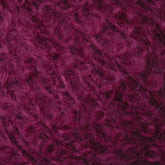 Close-up view of the Victorian Bouclé Mohair Yarn in a rich, deep burgundy color. The yarn appears fluffy and slightly fuzzy, indicating it might be made of a soft, delicate fiber like Mohair Bouclé from Caledonian Dye Works, suitable for knitting or crochet projects.