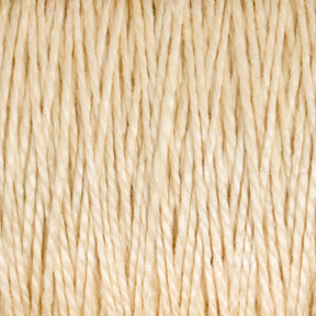 Close-up image of beige-colored textured yarn strands tightly wound together, creating a pattern of interwoven fibers. The 10/2 Pearl Cotton Yarn | Mini-cone by Supreme Corp. appears soft and slightly shiny, with a uniform thickness throughout, showcasing its versatile nature and excellent colorfastness.