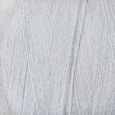 Close-up image of a tube of 8/2 Cottolin Organic Yarn in light gray from Maurice Brassard, perfect for your Cottolin Tea Towel Kit. The cotton linen blend is tightly wound and has a soft, slightly fuzzy texture. The threads are uniform in thickness, and the light gray color appears consistent throughout. Ideal for use on a four-shaft loom.