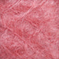 Close-up image of Victorian Brushed Mohair Yarn in a pink hue, showcasing its fluffy and fuzzy texture. The intertwined fibers create a dense and intricate pattern, drawing attention to the softness characteristic of Caledonian Dye Works' luxurious yarns. The delicate and wispy appearance evokes the fine quality of Victorian-era yarns.