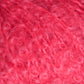 Close-up photo of the soft, curly, and fluffy Victorian Bouclé Mohair Yarn from Caledonian Dye Works. The texture appears dense and slightly shiny, with individual fibers visible, giving a sense of the yarn's intricate and plush composition. Part of Halcyon's Signature Victorian Collection, this yarn exudes timeless elegance.