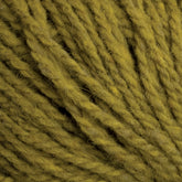 Close-up of green Harrisville Designs Shetland Yarn - Unwashed Cones, highlighting the textured fibers and twisted strands in detail. The yarn appears soft and somewhat fuzzy, with individual fibers clearly visible, creating a cozy and tactile feel perfect for Fair Isle knitting designs.