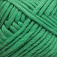 Close-up image of Lamb's Pride Bulky Yarn by Brown Sheep in a vibrant green color, tightly wound into a skein. The yarn showcases a soft, fuzzy texture with interwoven strands and appears thick, ideal for knitting or crocheting cozy Icelandic sweaters.