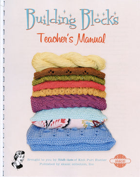 The cover of the Building Blocks Teacher's Manual showcases a neatly arranged stack of knitted squares in diverse colors and patterns, perfect for knitting classes. A vintage illustration of a smiling woman appears at the bottom left, while the Skacel logo is displayed at the bottom right.