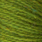 Close-up image of green Harrisville Designs Peace Fleece Yarn fibers, showing a texture with multiple intertwined strands. The wool and mohair blend has subtle variations in color, ranging from light to dark green, creating a rich and soft appearance.