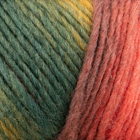 Close-up of a ball of Louisa Harding Amitola Grande by Knitting Fever / Euro Yarns, featuring a self-striping gradient transitioning from green to yellow to red. The texture appears soft and fibrous, showcasing the wrapped strands in detail. This worsted weight yarn offers a delightful blend for any crafting project.