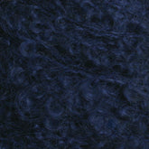 Close-up image of dark blue, tightly coiled curly hair from Caledonian Dye Works' Victorian Bouclé Mohair Yarn.