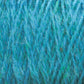 Close-up image of turquoise blue Harrisville Designs Harrisville Shetland Yarn - Unwashed Cones, showing the interwoven strands and fibers in detail. The yarn has a fluffy and slightly fuzzy texture, with visible threads and a mix of light and dark blue shades—perfect for lightweight blankets or Fair Isle knitting designs.