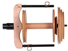 The Ashford Sliding Hook Flyer - Jumbo with Bobbin, by Ashford Handicrafts Limited, features two black metal rods and two hooks. This wooden unit is designed to hold the wheel and bobbin in place, facilitating the spinning process. It also includes pulleys on the right side for added functionality.