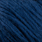 Close-up image of Cumulus Cotton by Juniper Moon Farm in a dark blue hue, showcasing its soft, fuzzy texture. The individual strands are clearly visible, intertwining to create a dense and tactile appearance. The rich, deep blue color of this yarn from Knitting Fever / Euro Yarns suggests a luxurious cotton material, perfect for weightless accessories that feel exquisitely gentle against the skin.