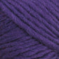 Close-up view of Lamb's Pride Bulky Yarn by Brown Sheep. The yarn appears soft, slightly fuzzy, and tightly wound into a skein. The rich, vibrant purple color and textured fibers are clearly visible—a perfect choice for knitters and crocheters crafting woven blankets or Icelandic sweaters.