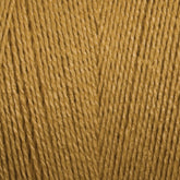 Close-up image of Maurice Brassard's 8/2 Bamboo Yarn | Tube in mustard yellow, showcasing its textured fibers. The yarn strands are neatly wound and display a consistent thickness, highlighting the smooth and slightly glossy appearance of this environmentally friendly, antibacterial material.