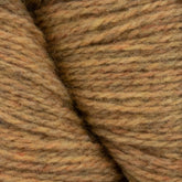 Close-up image of two skeins of Patagonia Organic Merino by Juniper Moon Farm, showcasing brown marled yarn with subtle variations in color, including shades of beige, tan, and hints of rust. The texture appears soft and slightly fuzzy, suggesting a blend from Knitting Fever / Euro Yarns.