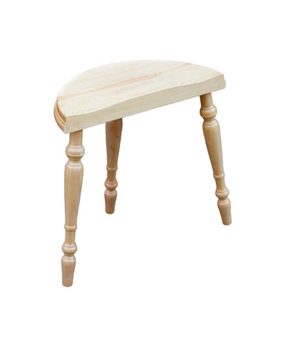 The Kromski Spinning Stool by Kromski North America features a small, light-colored wooden design with a semicircular seat and three ornate, turned legs. The natural wood grain is visible, giving it a rustic appearance that reflects quality woodworking. Reminiscent of traditional Kromski spinning wheel stools, this piece is showcased against a plain white background.