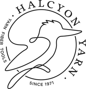 A minimalist logo showcases an abstract line drawing of a bird within a circular frame. The text "HALCYON YARN" wraps around the top and right side, while "YARN FIBER TOOLS" is displayed on the left. At the bottom of the circle, "Since 1971" is inscribed, evoking timeless craftsmanship like our Fiber Starter - spinning sample pack from Halcyon Yarn.